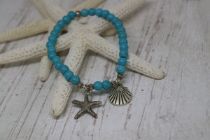 Blue Howlite bead bracelet with a silver starfish and shell charm