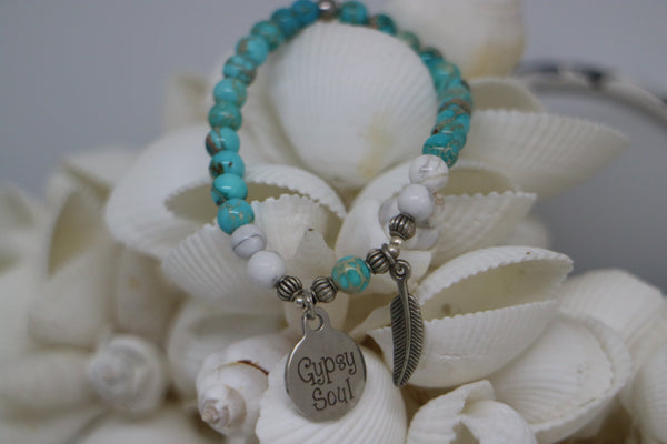 Load image into Gallery viewer, Blue Sea Sediment Jasper with white Howlite bead bracelet with silver &#39;gypsy soul&#39; and feather charms
