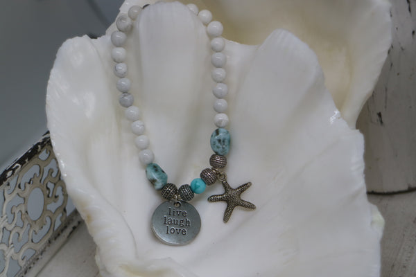 Load image into Gallery viewer, White Howlite and Larimar nugget beaded bracelet with silver &#39;live laugh love&#39; and starfish charm
