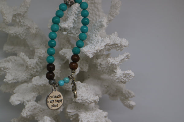Load image into Gallery viewer, Turquoise gemstone and wood beaded bracelet with silver &#39;the beach is my happy place&#39; and seahorse charms
