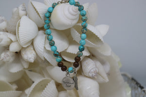Blue Sea Sediment Jasper and wood beaded bracelet with silver 'mermaid soul' and boho feather charm