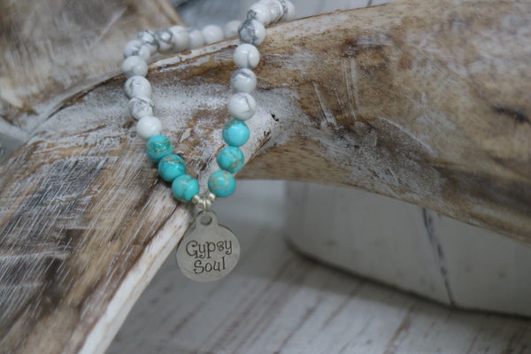 Load image into Gallery viewer, White howlite and blue sea sediment jasper gemstone beaded bracelet with silver &#39;gypsy soul&#39; charm
