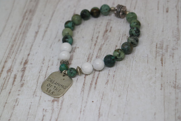 Load image into Gallery viewer, African Turquoise and white howlite beaded bracelet with silver rustic &#39;dreaming of the sea&#39; charm
