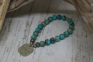 Blue Sea Sediment Jasper beaded bracelet with rustic silver 'dreaming of the sea' charm