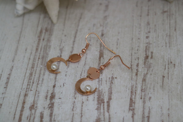 Load image into Gallery viewer, Rose gold pearl earrings with moon charms
