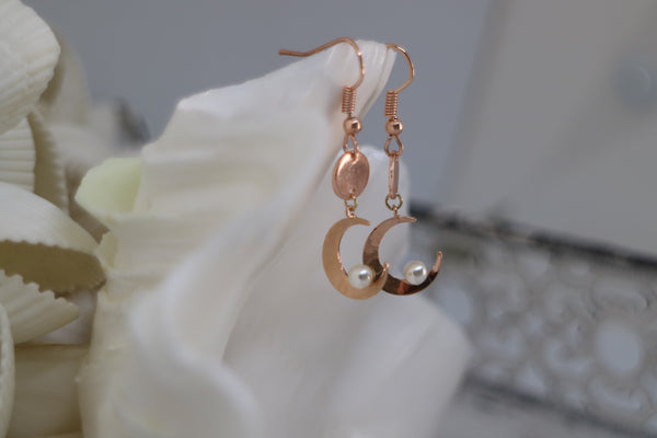 Load image into Gallery viewer, Rose gold pearl earrings with moon charms
