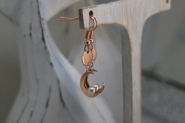 Load image into Gallery viewer, Rose gold pearl earrings with moon charms
