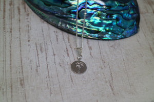 Silver rhodium palm tree coin necklace