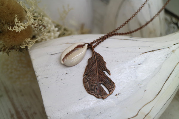 Load image into Gallery viewer, Bohemian copper feather and cowrie shell necklace
