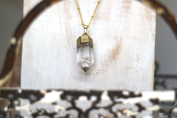 Load image into Gallery viewer, Clear quartz point gold bohemian necklace
