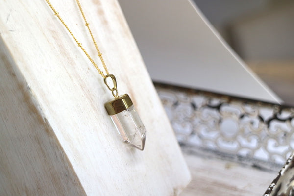 Load image into Gallery viewer, Clear quartz point gold bohemian necklace
