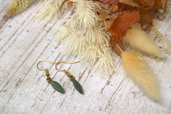 Load image into Gallery viewer, Green patina and gold bohemian leaf earrings
