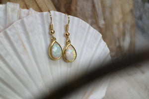 White opal teardrop gold earrings