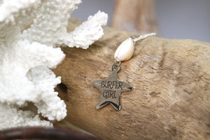 Silver cowrie shell and surfer girl starfish pendant necklace