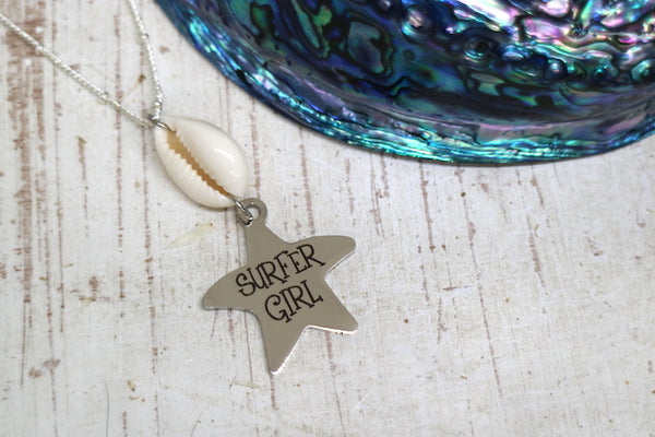 Load image into Gallery viewer, Silver cowrie shell and surfer girl starfish pendant necklace
