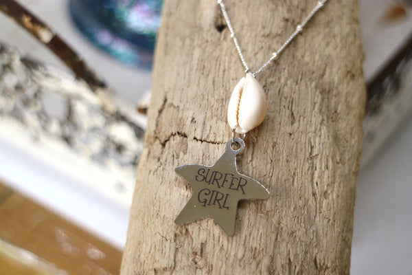 Load image into Gallery viewer, Silver cowrie shell and surfer girl starfish pendant necklace
