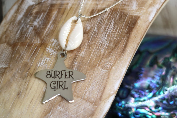 Load image into Gallery viewer, Silver cowrie shell and surfer girl starfish pendant necklace
