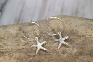 Silver starfish hoop earrings