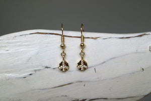 Gold cubic zirconia peace earrings
