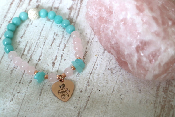 Load image into Gallery viewer, Childrens rose quartz and amazonite bead bracelet with rose gold beach girl charm
