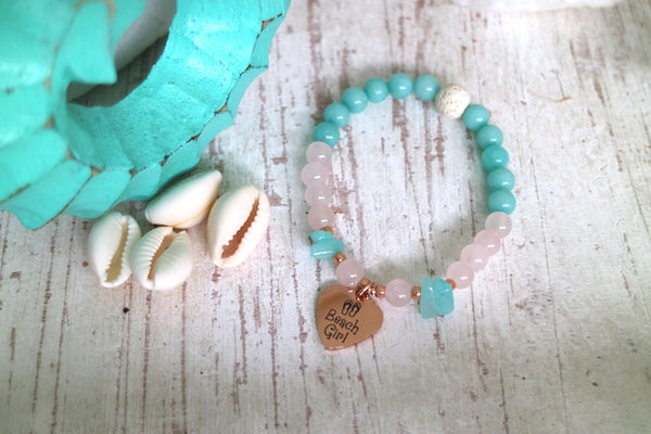 Load image into Gallery viewer, Childrens rose quartz and amazonite bead bracelet with rose gold beach girl charm
