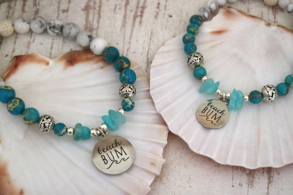 Load image into Gallery viewer, Blue sea jasper and white howlite and amazonite bracelet with silver beach bum charm

