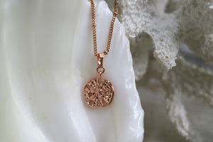 Rose gold sand dollar shell necklace