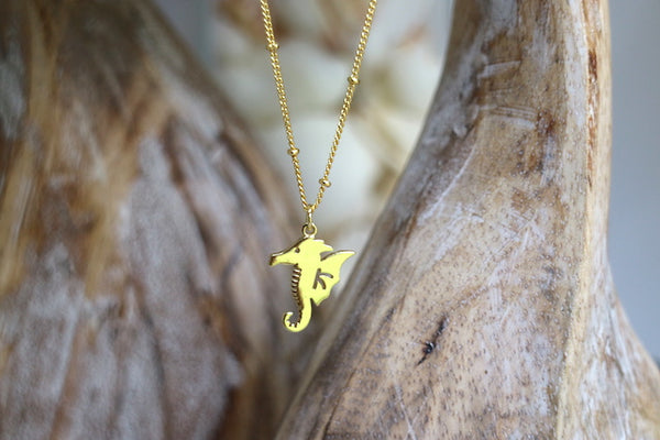 Load image into Gallery viewer, Gold seahorse necklace
