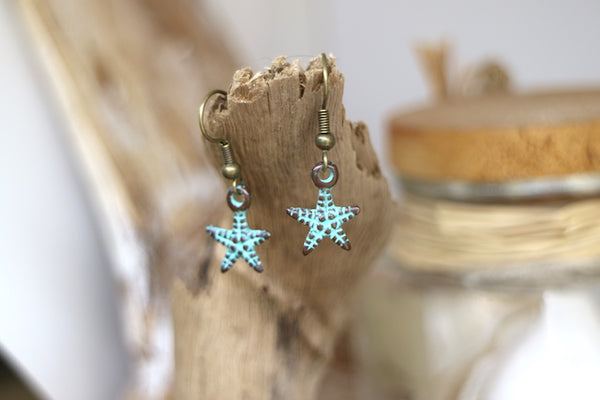 Load image into Gallery viewer, Bronze blue patina starfish earrings
