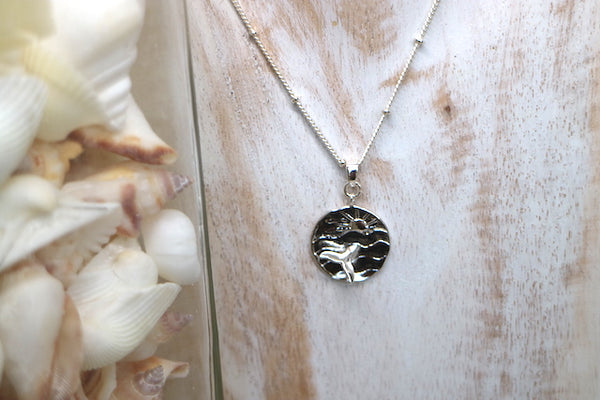 Load image into Gallery viewer, Children&#39;s silver sun and whale tail ocean necklace
