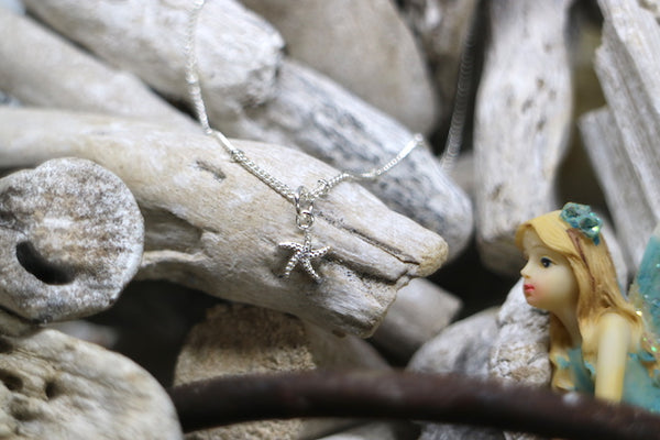 Load image into Gallery viewer, Children&#39;s silver starfish necklace with cubic zirconia
