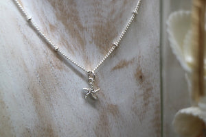 Children's silver starfish necklace with cubic zirconia