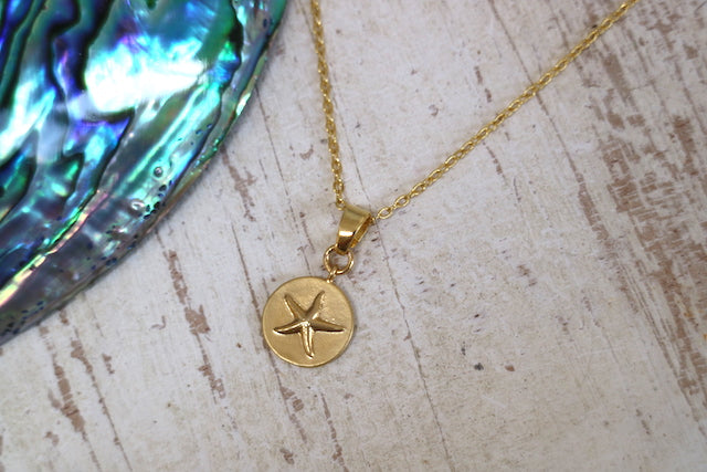 Gold starfish coin necklace