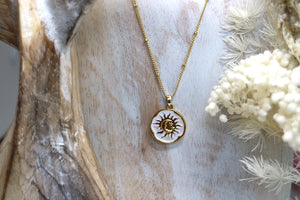 Gold and white moon and sun pendant necklace