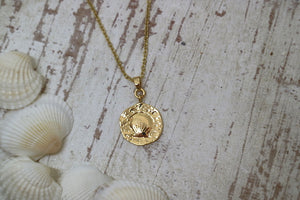 Gold shell coin pendant necklace
