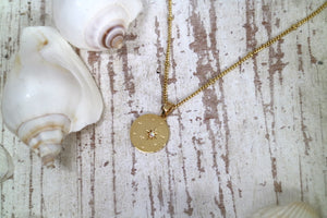 White opal and star gold coin necklace