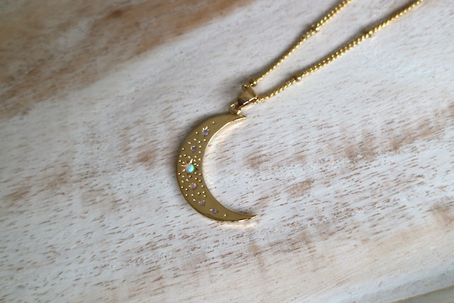 Gold moon pendant with opal stars necklace