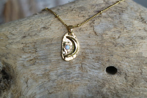 White opal and cubic zirconia moon and stars gold necklace