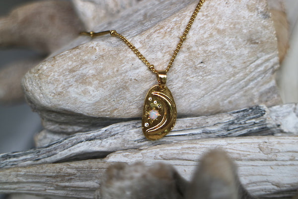 Load image into Gallery viewer, White opal and cubic zirconia moon and stars gold necklace
