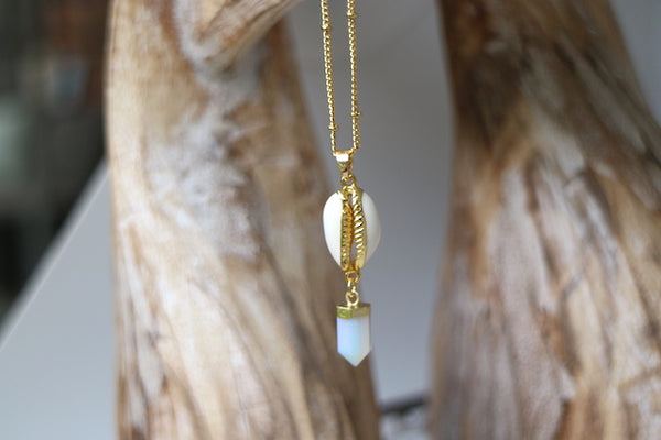 Load image into Gallery viewer, Opalite crystal point and cowrie shell gold necklace
