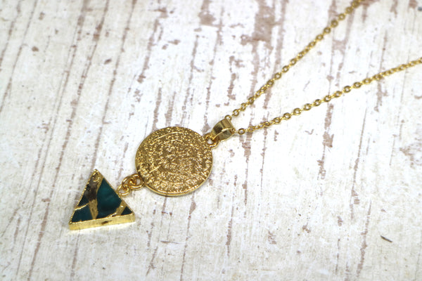 Load image into Gallery viewer, Mohave Turquoise and gold rune symbol necklace
