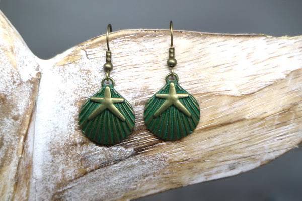 Load image into Gallery viewer, Bronze patina shell and starfish earrings
