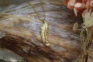 Gold feather necklace