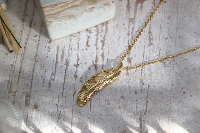Gold feather necklace