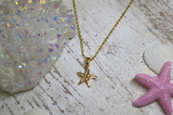 Load image into Gallery viewer, Children&#39;s cubic zirconia gold starfish necklace
