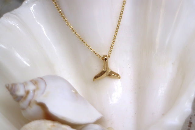 Gold whale tail necklace